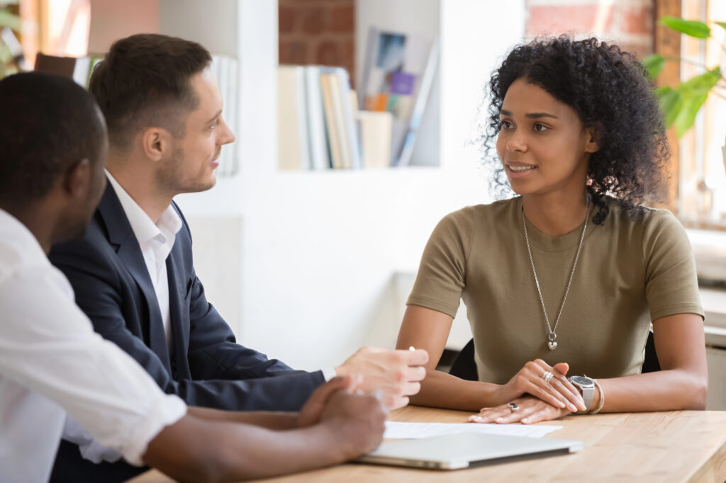 A professional job interview where an accounting candidate discusses her career qualifications with a hiring manager.